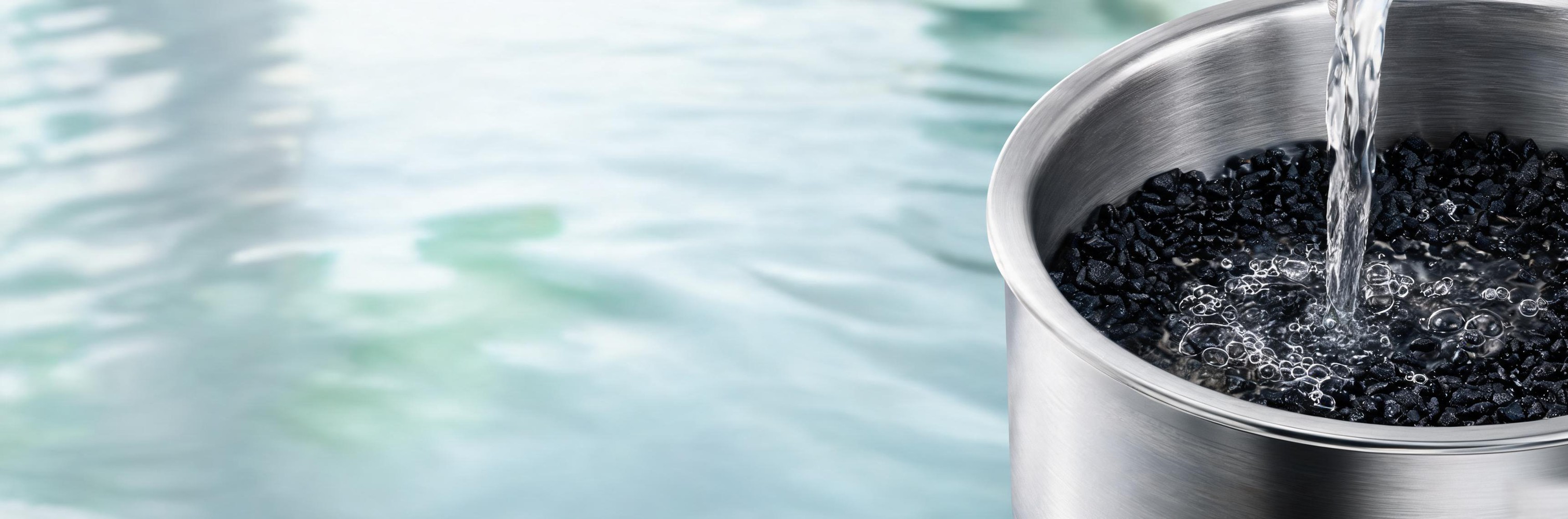 Industrial water treatment equipment supported by activated carbon filtration.